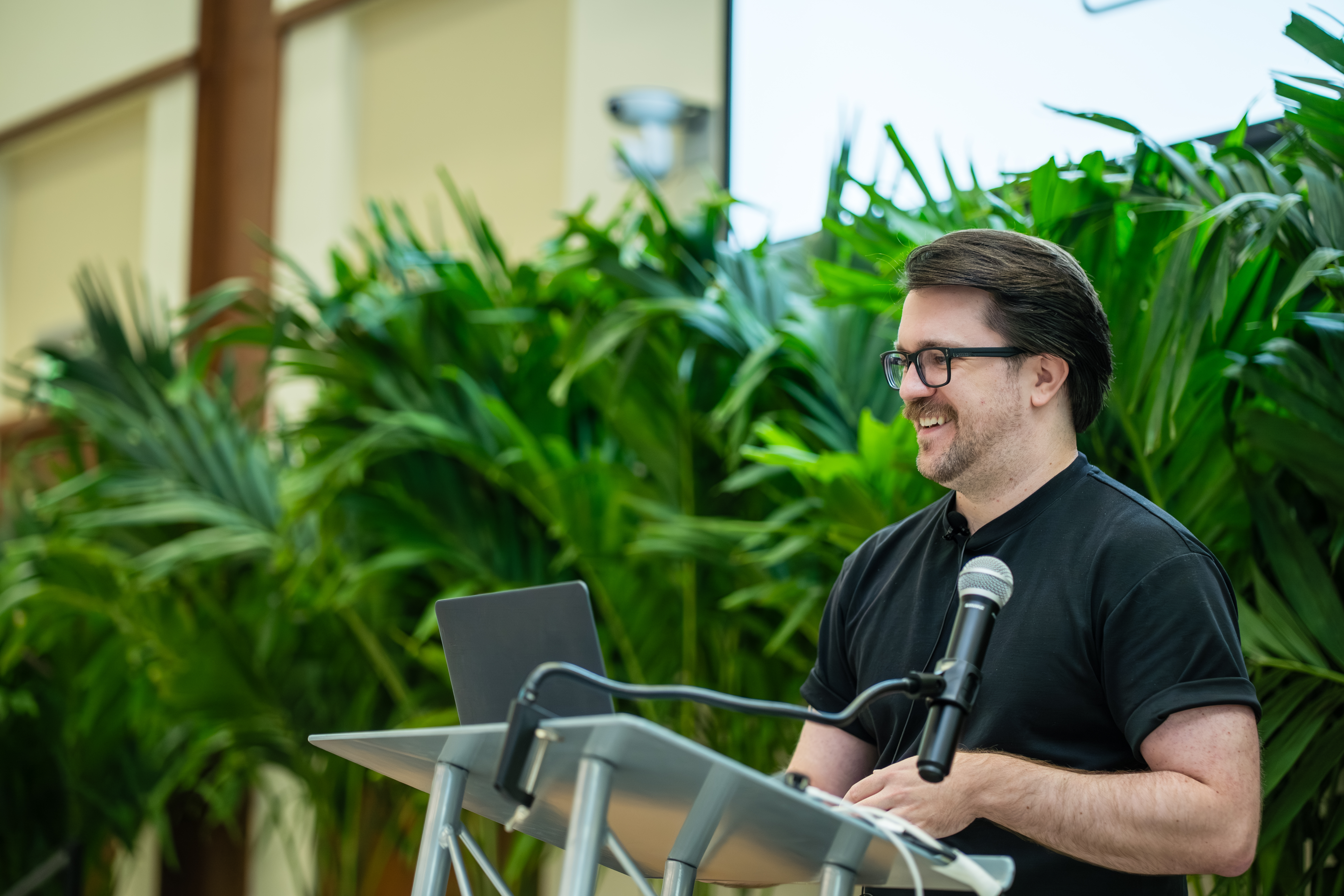 Me, standing up on a stage and smiling.